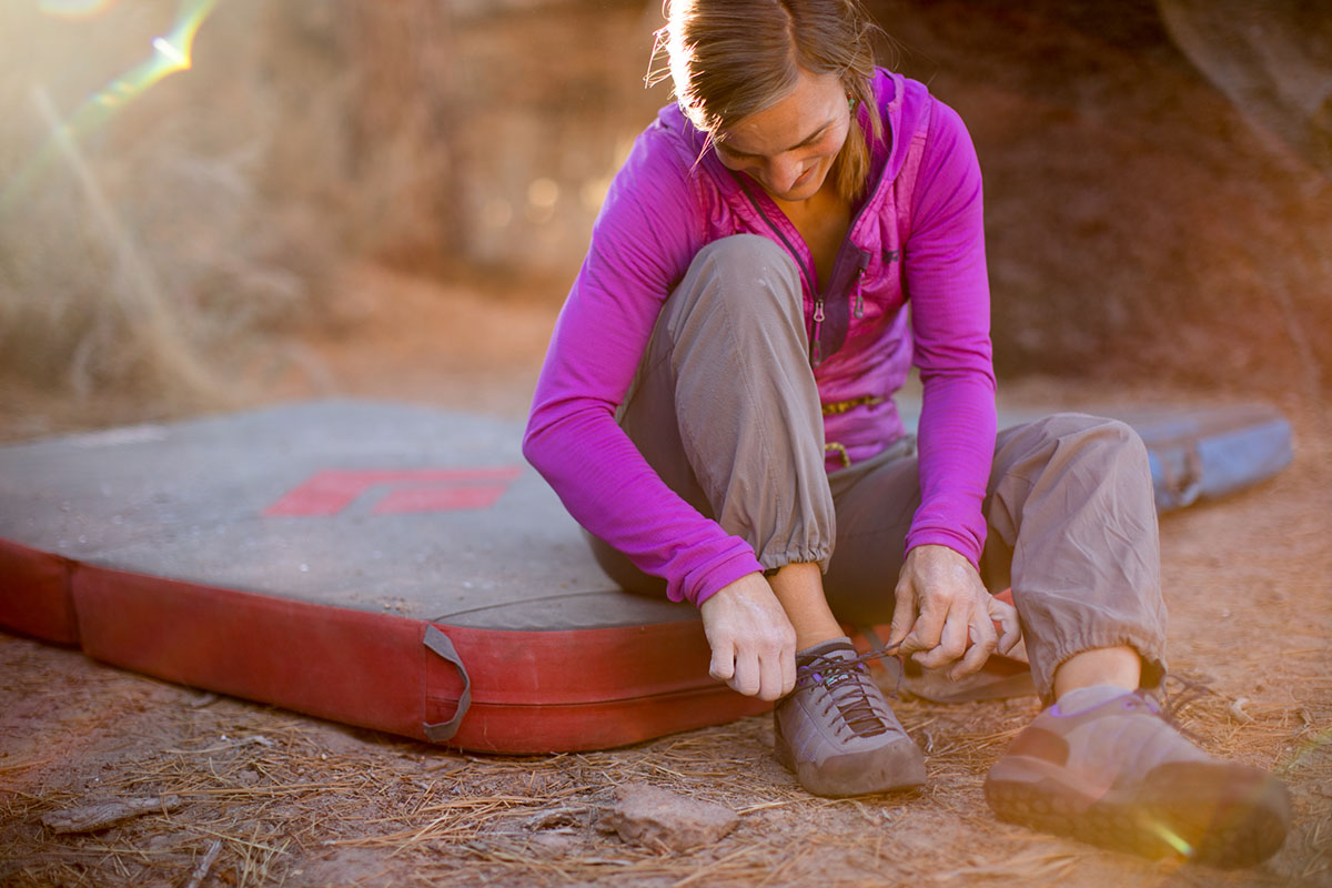 Crash pad (sitting on pad putting on shoes)